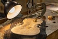 Close-up of a professional master artisan luthier working on the creation of a handmade violin