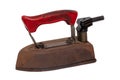 Close-up of a professional old rusty electric tailor iron or flatiron with a red handle and vintage power plug isolated on a white Royalty Free Stock Photo