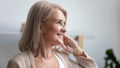 Close up profile smiling mature woman dreaming about good future Royalty Free Stock Photo