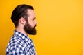 Close-up profile side view portrait of his he nice attractive calm content bearded guy wearing checked shirt copy space