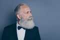 Close-up profile side view portrait of his he nice attractive content well-groomed gray-haired man wearing tux tuxedo