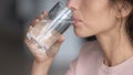 Close up profile thirsty woman drinking pure mineral water