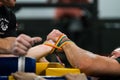 Close up profile view of straped hands, arm wrestling. Royalty Free Stock Photo