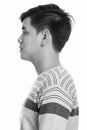 Close up profile view of young handsome Asian man Royalty Free Stock Photo