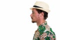 Close up profile view of young handsome tourist man isolated aga Royalty Free Stock Photo