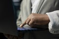 Close up of programmer in data center typing on notebook keyboard, writing code Royalty Free Stock Photo