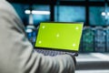 Close up of programmer in data center using green screen laptop Royalty Free Stock Photo