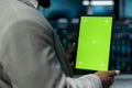 Close up of programmer in data center using isolated screen tablet Royalty Free Stock Photo