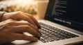Close up of programmer hands typing code on a modern laptop keyboard Royalty Free Stock Photo