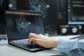 Close up of programmer typing on laptop keyboard, optimizing performance with AI Royalty Free Stock Photo