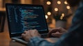 Close-Up of Programmer Working on Laptop with Code on Screen