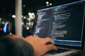 A close-up of a programmer& x27;s hands and keyboard. A programmer is writing software code by hand. Royalty Free Stock Photo