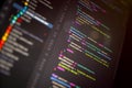 Close up of programming code on computer screen in dark mode, illustrating software development, coding workflow, and digital Royalty Free Stock Photo