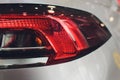 Close up projector Taillight of the modern and elegant car, automotive part concept. Royalty Free Stock Photo