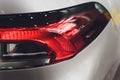 Close up projector Taillight of the modern and elegant car, automotive part concept. Royalty Free Stock Photo