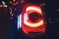 Close up projector Taillight of the modern and elegant car, automotive part concept. Royalty Free Stock Photo