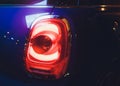 Close up projector Taillight of the modern and elegant car, automotive part concept. Royalty Free Stock Photo