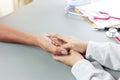 Close up psychiatrist hands together holding the palm of a patient with  love, comfort and empathy. Helping hand concept in clinic Royalty Free Stock Photo