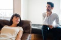 Psychologist taking notes during therapy session. Royalty Free Stock Photo