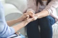 Close up of psychologist touching female patient hands Royalty Free Stock Photo