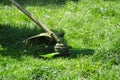 Close-up of public utilities mow the grass in the park