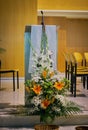 close-up of the pulpit & x28;ambon& x29; in a modern Catholic church with flower decoration in the foreground Royalty Free Stock Photo