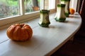 Close Up of Pumpkin and Pots in English Cottage in Countryside in front of Window Royalty Free Stock Photo