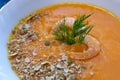 close-up pumpkin soup with prawns, pumpkin seeds whole and broken and decorated with dill Royalty Free Stock Photo