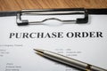 Close up of purchase order form with pen Royalty Free Stock Photo