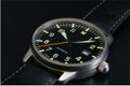 Close up a puristic wrist watch with leather strap Royalty Free Stock Photo