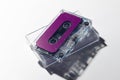 Close up of purple cassette tape and white box on white background Royalty Free Stock Photo