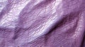 A close up of a purple leather