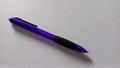 Close-up purple pen isolated white paper background Royalty Free Stock Photo