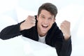 Close up.purposeful young man, breaking through a paper wall. Royalty Free Stock Photo