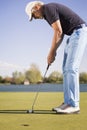 Close up of a putting golf player. Royalty Free Stock Photo