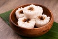 Putu bambu or steamed rice flour cake with grated coconut and palm sugar filling