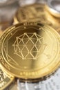 Close-up of qtum physical coin on stack of many other cryptocurrencies Royalty Free Stock Photo