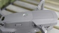 Close up of quadrocopter or drone details. Action. Professional shooting equipment, grey quadcopter body with glowing Royalty Free Stock Photo