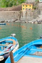 Close-up of quaint European style fishing boats with outboard motor moored in Cinque Terre traditional fishing village