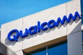 Close up. Qualcomm logo atop company office. Qualcomm Incorporated is an American multinational semiconductor and