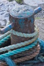 Close up of quayside bollard with mooring ropes Royalty Free Stock Photo