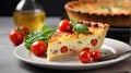 Close up of quiche lorraine with salad and cherry tomatoes on the side