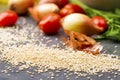 Close up of quinoa grains cherry tomato, onion and parsley