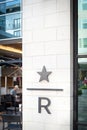 Close-up R logo Starbucks Reserve at faÃÂ§ade entrance upscale coffee shop located in Legacy West in Plano, Texas, America