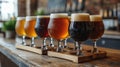 Close up of a rack of different kinds of beers, dark to light, on a table. Royalty Free Stock Photo