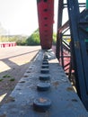 Close-up of the rack and pinion of an old rusty steel rolling lift bridge.