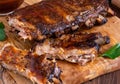 Close up of a rack of spareribs covered in barbecue sauce ready for eating.