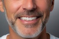 Close-up of a Radiant Smile. Senior Man with Pristine Teeth after a Visit to the Dentist