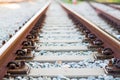 Close up rail joint, rail anchor with perspective line from railroad tracks.