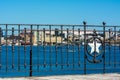 Close up of the railing in Taranto on blurred industrial site called Ilva background Royalty Free Stock Photo